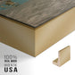Close-up of the gold floater frame corner and gallery wrapped canvas construction.
