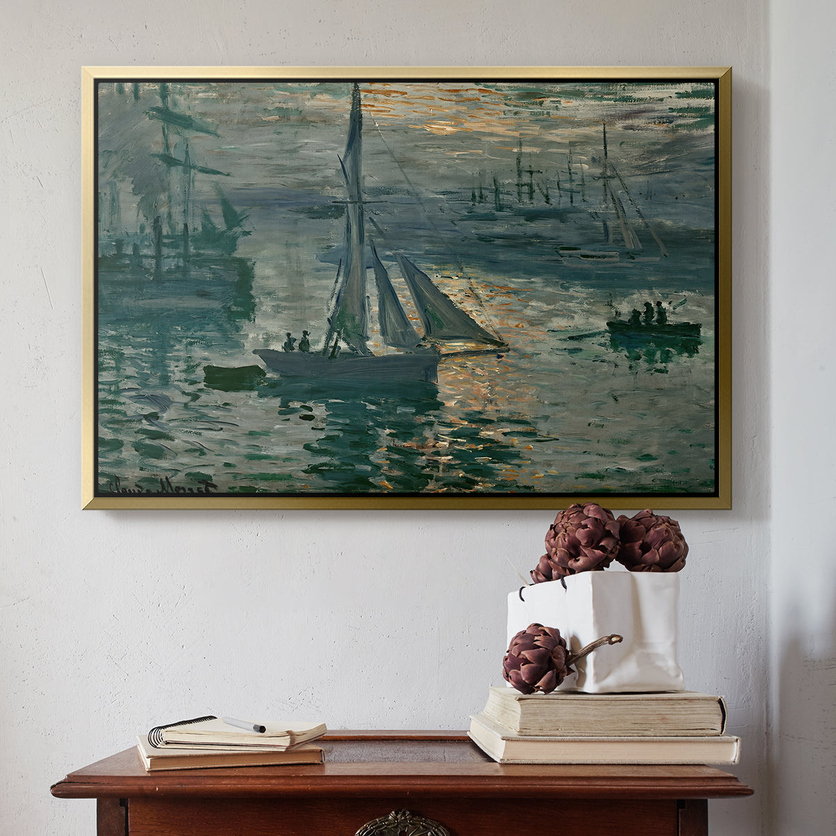 Gold floater framed canvas featuring Sunrise (Marine), 1873 by Claude Monet above an entryway table in a minimalist foyer.