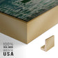 Close-up of the gold floater frame corner and gallery wrapped canvas construction.