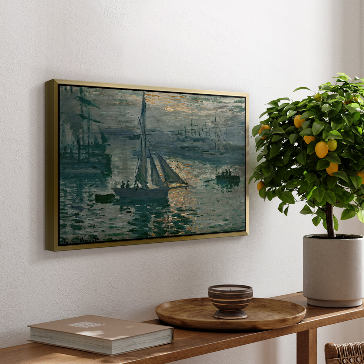 Sunrise (Marine), 1873 by Claude Monet, presented in a gold floater framed canvas featuring a hazy sunrise over harbor with boats silhouetted in soft morning light, displayed above a hallway console table.