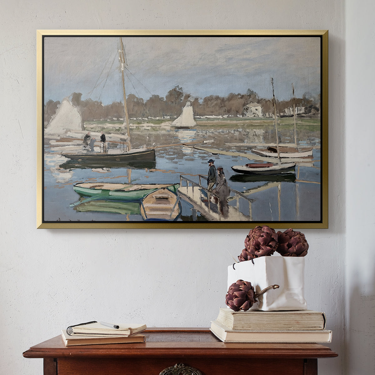 Gold floater framed canvas featuring The Basin at Argenteuil, 1874 by Claude Monet above an entryway table in a minimalist foyer.