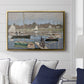 The Basin at Argenteuil, 1874 by Claude Monet displayed above a sofa in a living room in a gold floater frame, featuring an impressionist boating scene with clustered masts and gentle ripples.