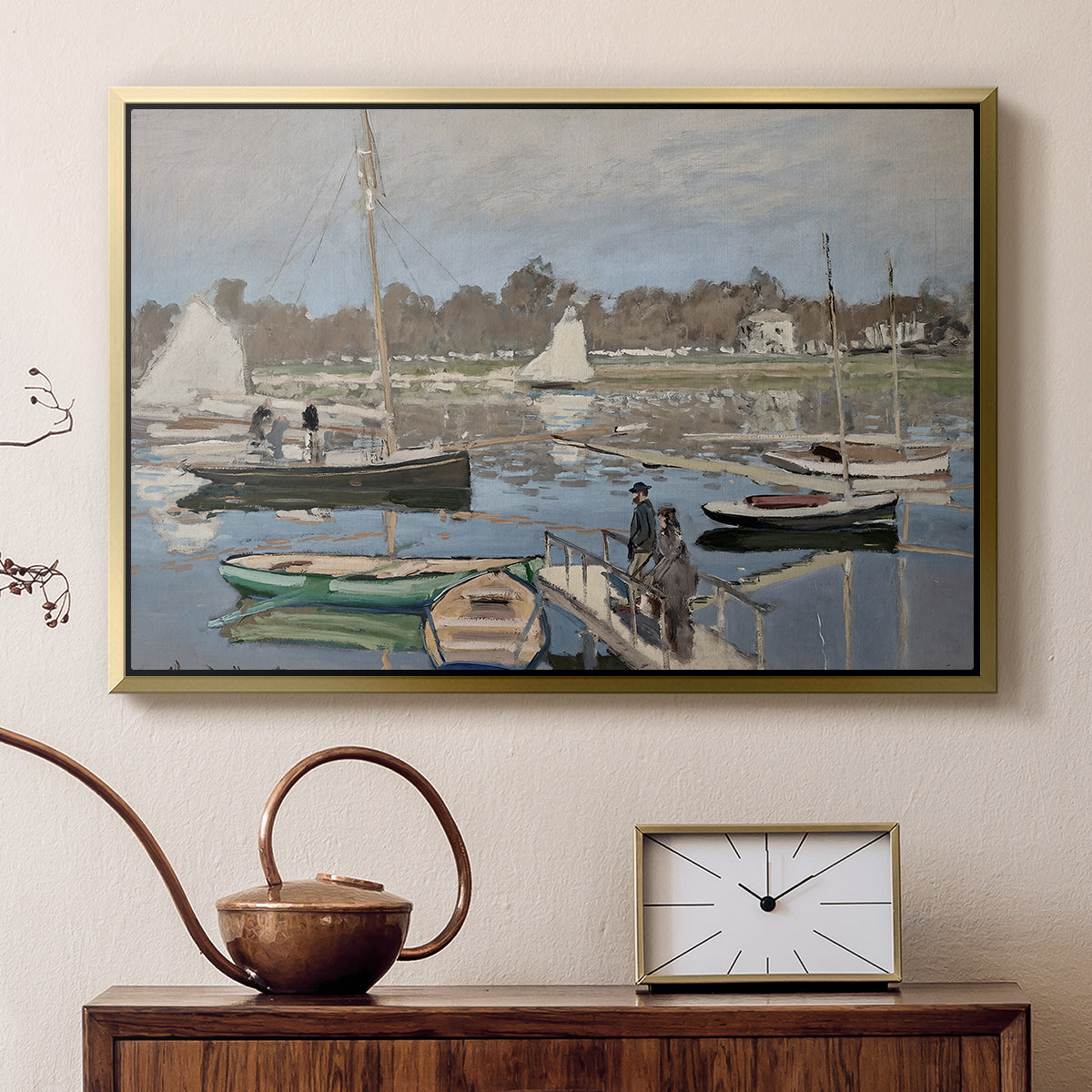 Gold floater framed canvas featuring a harbor basin filled with boats under soft sky, displayed above a cabinet in a soft-toned living room.
