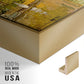 Close-up of the gold floater frame corner and gallery wrapped canvas construction.