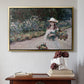 Gold floater framed canvas featuring Young Girl in the Garden at Giverny, 1888 by Claude Monet above an entryway table in a minimalist foyer.