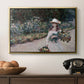 Young Girl in the Garden at Giverny, 1888 by Claude Monet in a gold floater framed canvas displayed above a console table in a hallway, featuring a tranquil outdoor portrait of girl in floral setting.