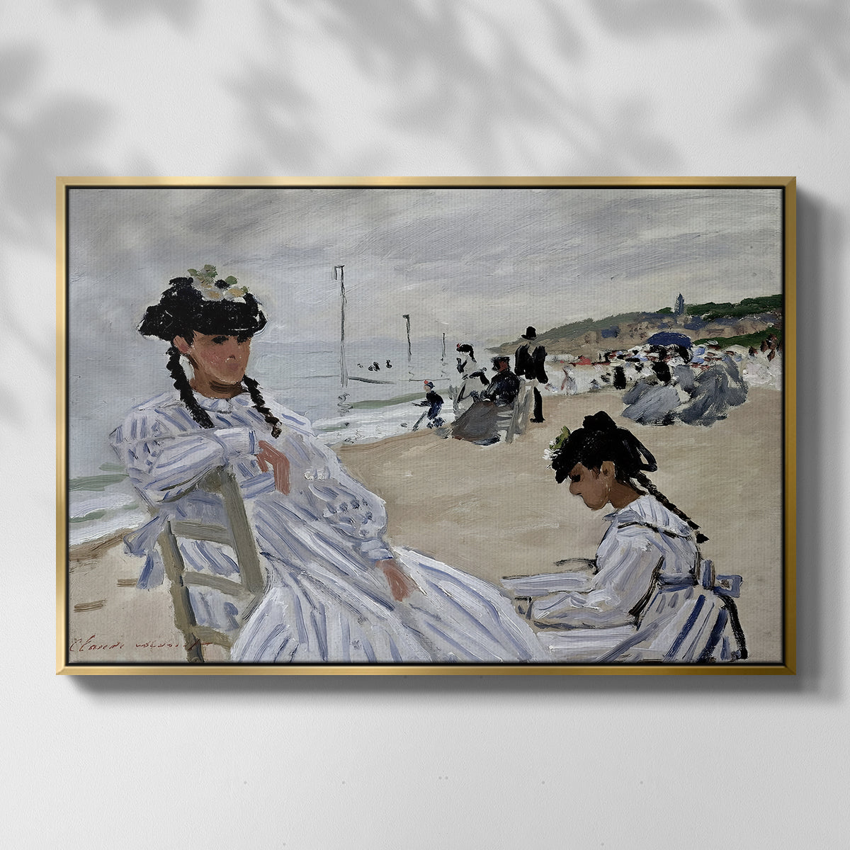 Front view of On the Beach at Trouville, 1870 by Claude Monet in a gold floater framed canvas.