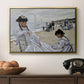 On the Beach at Trouville, 1870 by Claude Monet in a gold floater framed canvas displayed above a console table in a hallway, featuring a coastal leisure scene with figures looking out to sea.