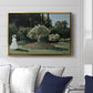 Woman in the Garden, Sainte-Adresse, 1867 by Claude Monet displayed above a sofa in a living room in a gold floater frame, featuring an impressionist figure in sunlit garden with lush vegetation.