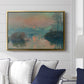 Sunset on the Seine at Lavacourt, Winter Effect, 1880 by Claude Monet displayed above a sofa in a living room in a gold floater frame, featuring a winter scene with warm light reflecting on water at dusk.