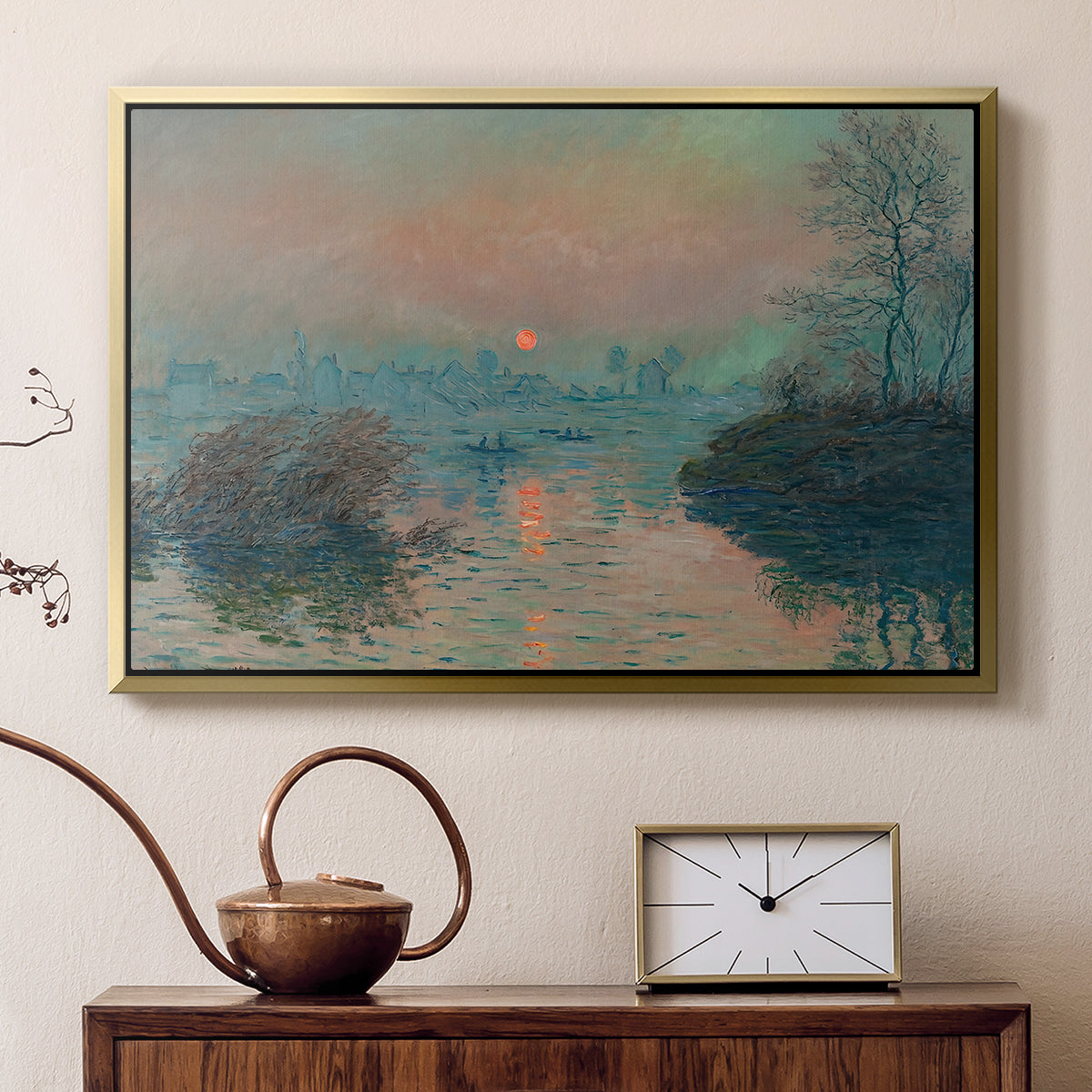 Gold floater framed canvas featuring an impressionist view of river at sunset with snowy banks, displayed above a cabinet in a soft-toned living room.