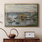 Gold floater framed canvas featuring a calm water scene with bridge fading into cloudy sky, displayed above a cabinet in a soft-toned living room.