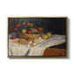 Still Life with Apples and Grapes, 1880 by Claude Monet in a gold floater framed canvas wall art display.
