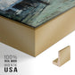 Close-up of the gold floater frame corner and gallery wrapped canvas construction.