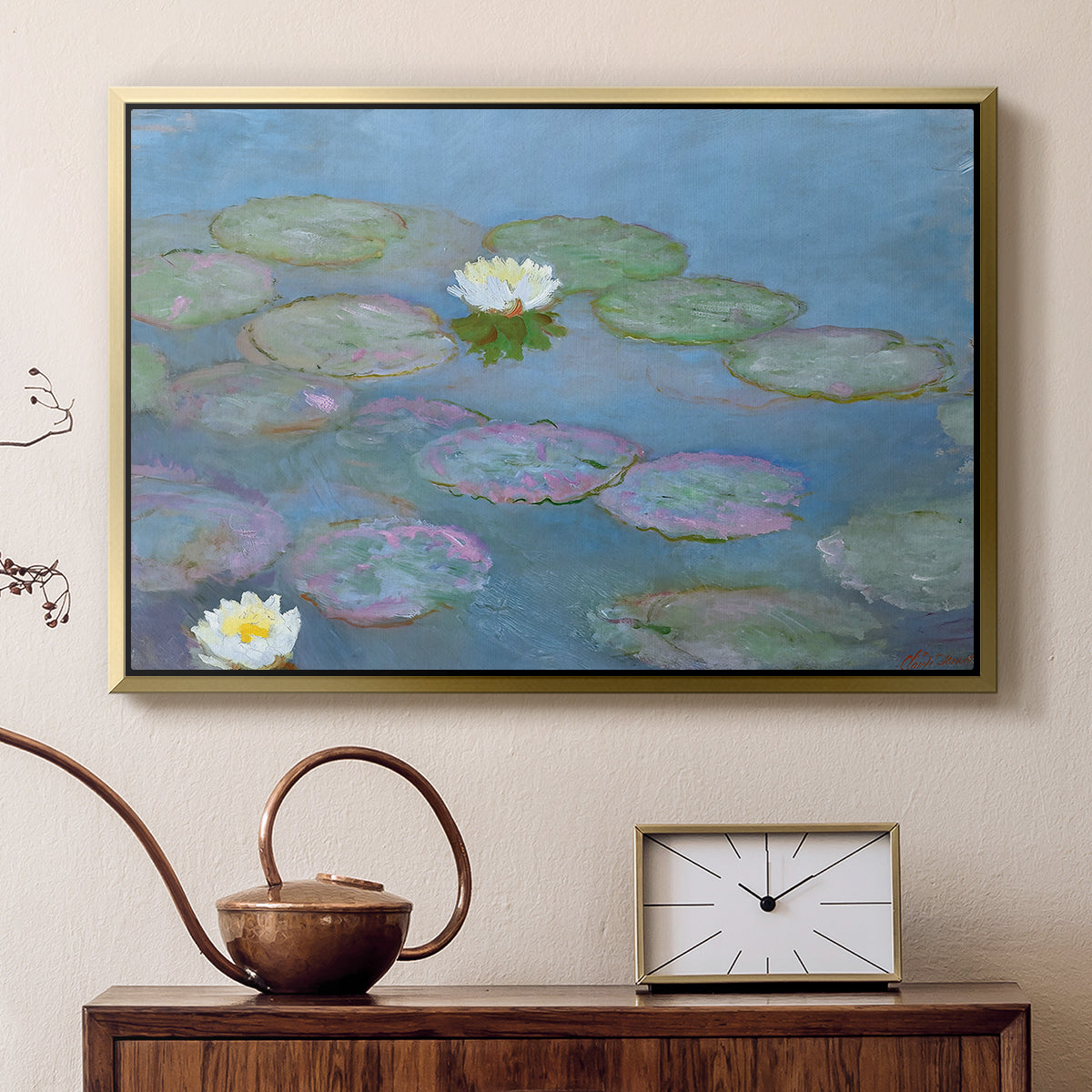 Gold floater framed canvas featuring a tranquil water surface covered with blooming lilies, displayed above a cabinet in a soft-toned living room.