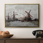 Windmills near Zaandam, 1871 by Claude Monet in a gold floater framed canvas displayed above a console table in a hallway, featuring a landscape featuring windmills and low horizon sky.