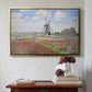 Gold floater framed canvas featuring Tulip Fields with the Rijnsburg Windmill, 1886 by Claude Monet above an entryway table in a minimalist foyer.
