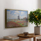 Tulip Fields with the Rijnsburg Windmill, 1886 by Claude Monet, presented in a gold floater framed canvas featuring colorful rows of tulip fields leading toward distant windmill, displayed above a hallway console table.