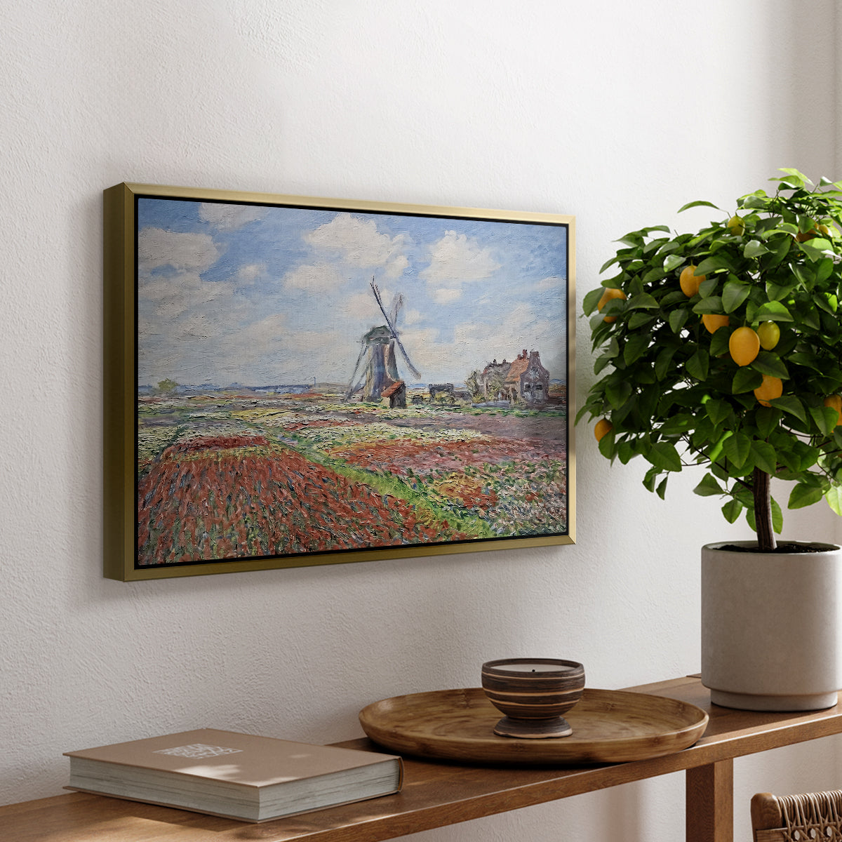 Tulip Fields with the Rijnsburg Windmill, 1886 by Claude Monet, presented in a gold floater framed canvas featuring colorful rows of tulip fields leading toward distant windmill, displayed above a hallway console table.