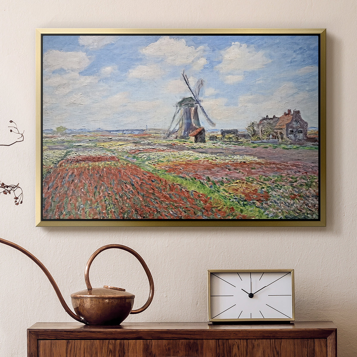 Gold floater framed canvas featuring an impressionist field of blooming tulips under bright sky, displayed above a cabinet in a soft-toned living room.