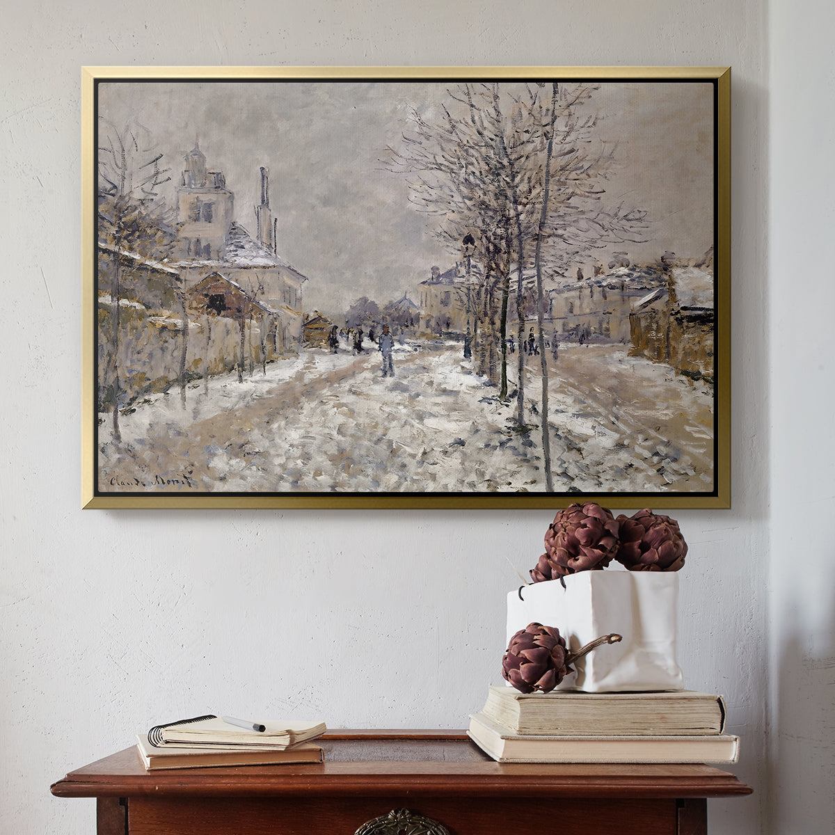 Gold floater framed canvas featuring The Boulevard de Pontoise at Argenteuil, Snow Effect, 1875 by Claude Monet above an entryway table in a minimalist foyer.