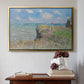 Gold floater framed canvas featuring The Cliff Walk at Pourville, 1882 by Claude Monet above an entryway table in a minimalist foyer.