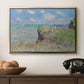 The Cliff Walk at Pourville, 1882 by Claude Monet in a gold floater framed canvas displayed above a console table in a hallway, featuring an elevated shoreline path with figures and bright sky.