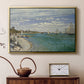 Gold floater framed canvas featuring an impressionist coastal view with colorful sails and shoreline activity, displayed above a cabinet in a soft-toned living room.