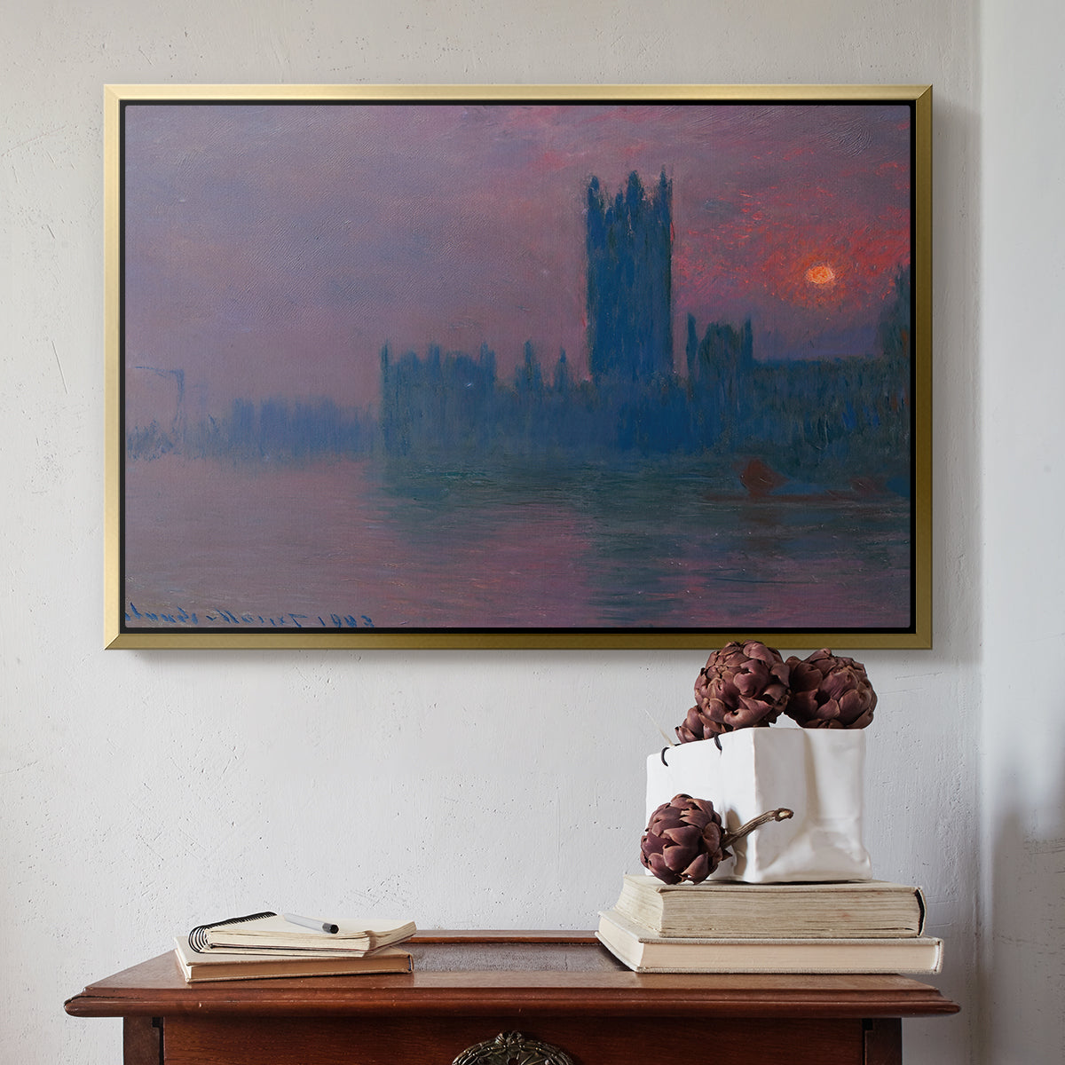 Gold floater framed canvas featuring The Houses of Parliament, Sunset, 1903 by Claude Monet above an entryway table in a minimalist foyer.