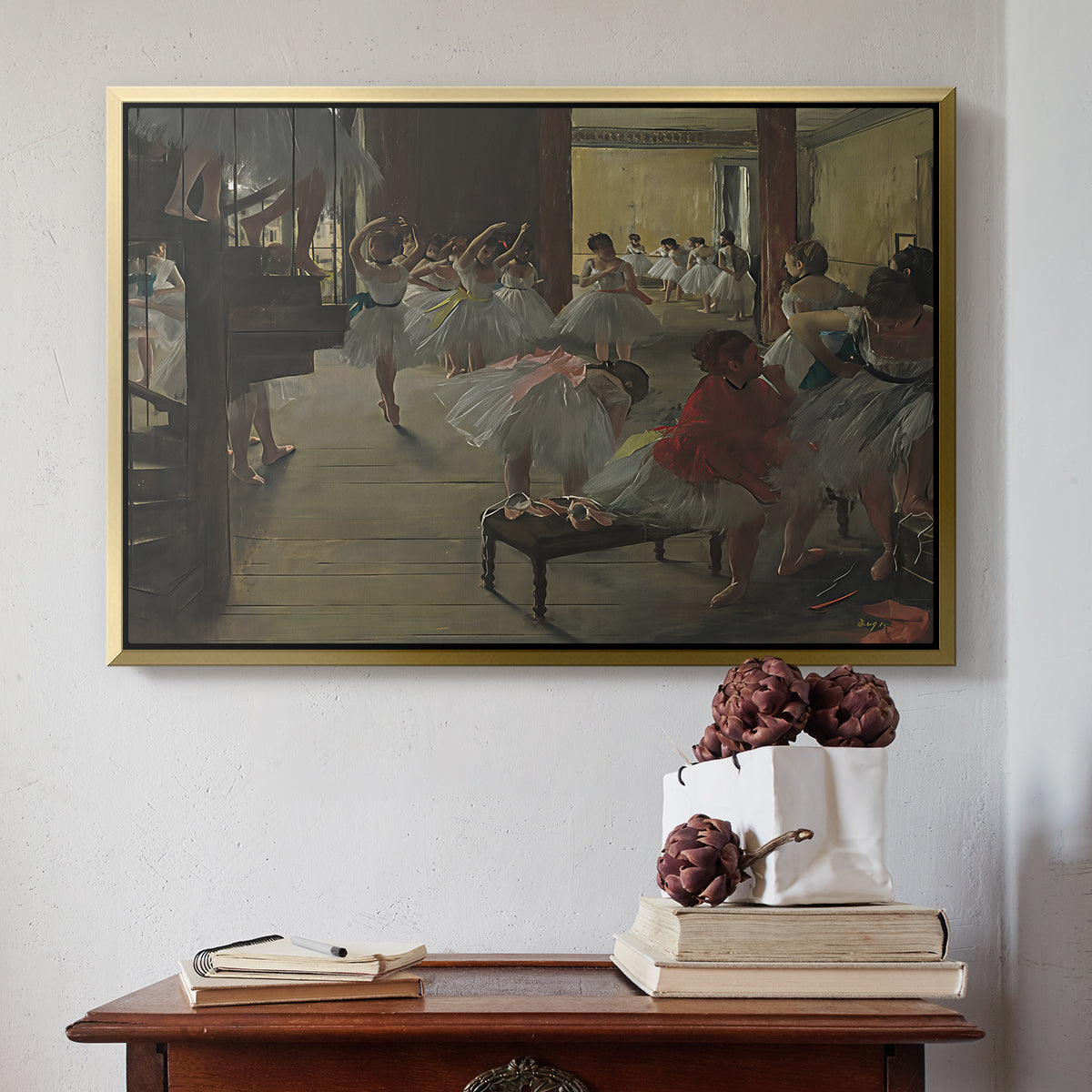 Gold floater framed canvas featuring The Dance Class, c. 1873 by Edgar Degas above an entryway table in a minimalist foyer.