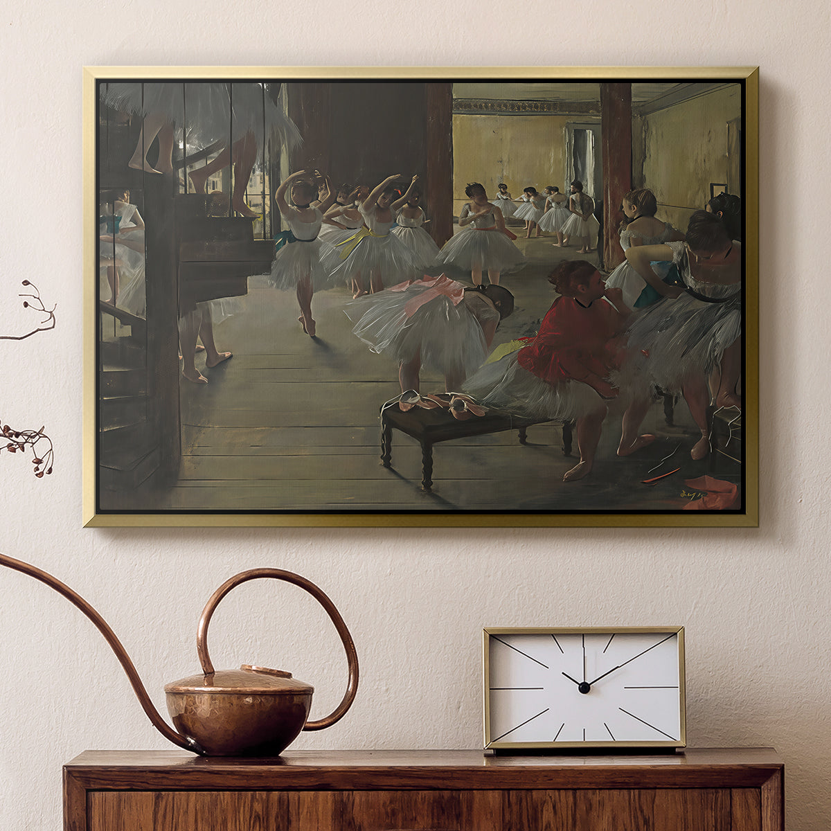 Gold floater framed canvas featuring an impressionist studio interior filled with ballet students, displayed above a cabinet in a soft-toned living room.
