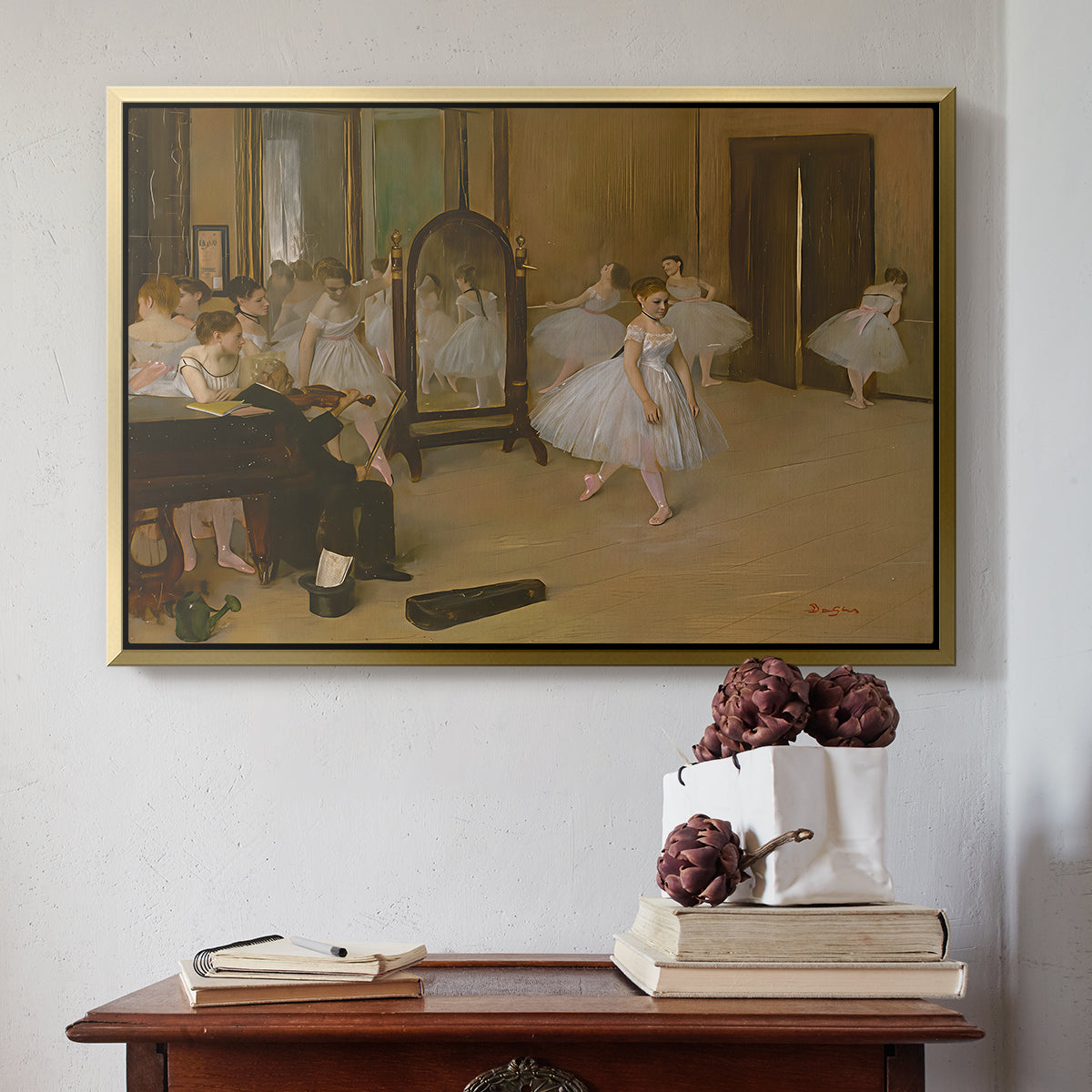 Gold floater framed canvas featuring The Dancing Class, c. 1870 by Edgar Degas above an entryway table in a minimalist foyer.