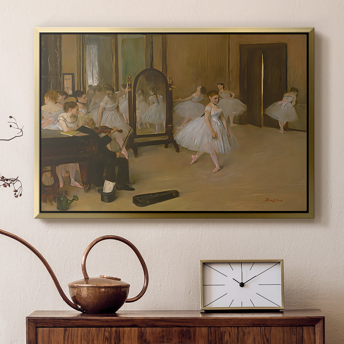 Gold floater framed canvas featuring an impressionist interior capturing movement and discipline of dancers, displayed above a cabinet in a soft-toned living room.