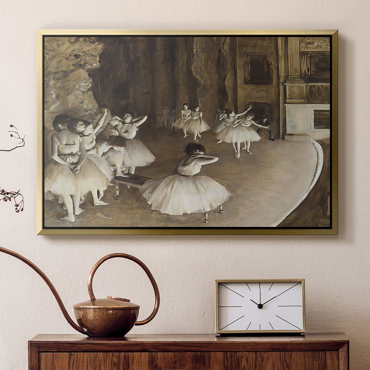Gold floater framed canvas featuring an impressionist depiction of ballet practice on theater stage, displayed above a cabinet in a soft-toned living room.