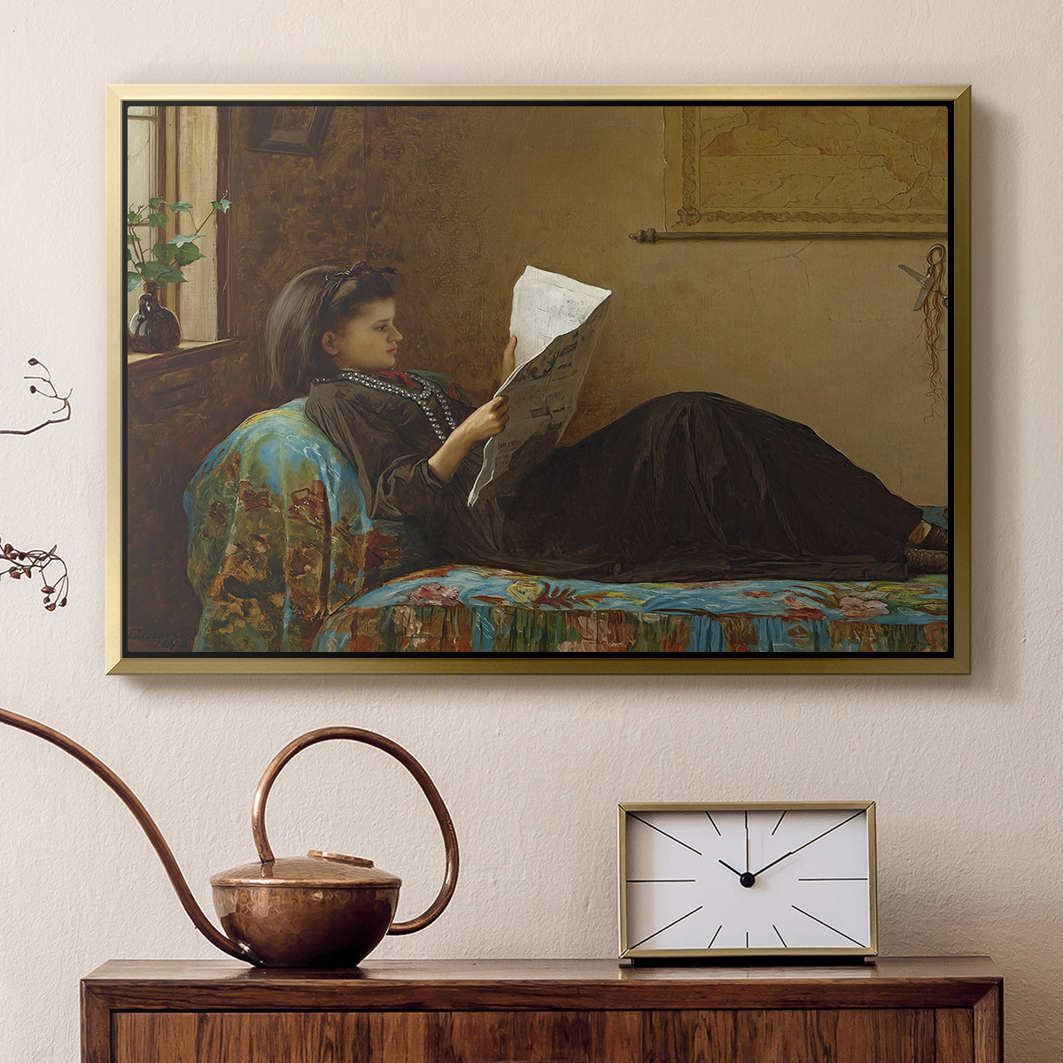 Gold floater framed canvas featuring an Americana interior with people focused on printed page, displayed above a cabinet in a soft-toned living room.