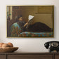 Interesting News, 1872 by Eastman Johnson in a gold floater framed canvas displayed above a console table in a hallway, featuring a casual gathering around newspaper in rustic room.