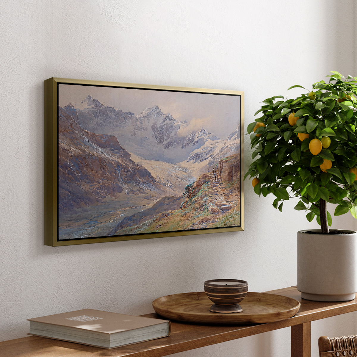 Odenwinklkees with the Johannisberg, 1902 by Edward Theodore Compton, presented in a gold floater framed canvas featuring an alpine glacier landscape with rugged peaks and snow-covered terrain, displayed above a hallway console table.
