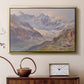 Gold floater framed canvas featuring a realistic depiction of high-altitude snowy peaks, displayed above a cabinet in a soft-toned living room.