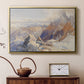 Gold floater framed canvas featuring a panoramic alpine view with snow and rocky cliffs, displayed above a cabinet in a soft-toned living room.