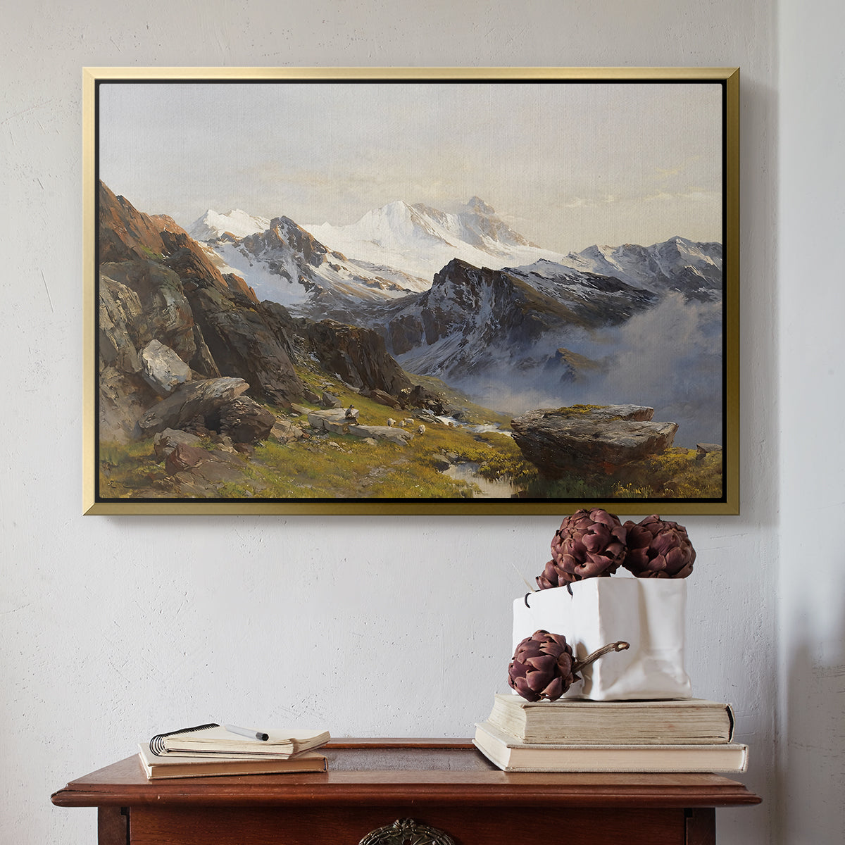 Gold floater framed canvas featuring The Großglockner from the Prager Hut, 1890 by Edward Theodore Compton above an entryway table in a minimalist foyer.