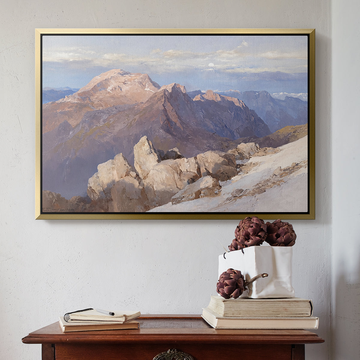 Gold floater framed canvas featuring Hoher Göll from Watzmann-Hocheck, 1919 by Edward Theodore Compton above an entryway table in a minimalist foyer.