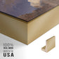 Close-up of the gold floater frame corner and gallery wrapped canvas construction.