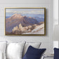 Hoher Göll from Watzmann-Hocheck, 1919 by Edward Theodore Compton displayed above a sofa in a living room in a gold floater frame, featuring an alpine panorama showing layered peaks and valleys.