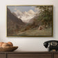Landscape in the Caucasus, c. 1921 by Edward Theodore Compton in a gold floater framed canvas displayed above a console table in a hallway, featuring a realistic depiction of remote mountain environment.