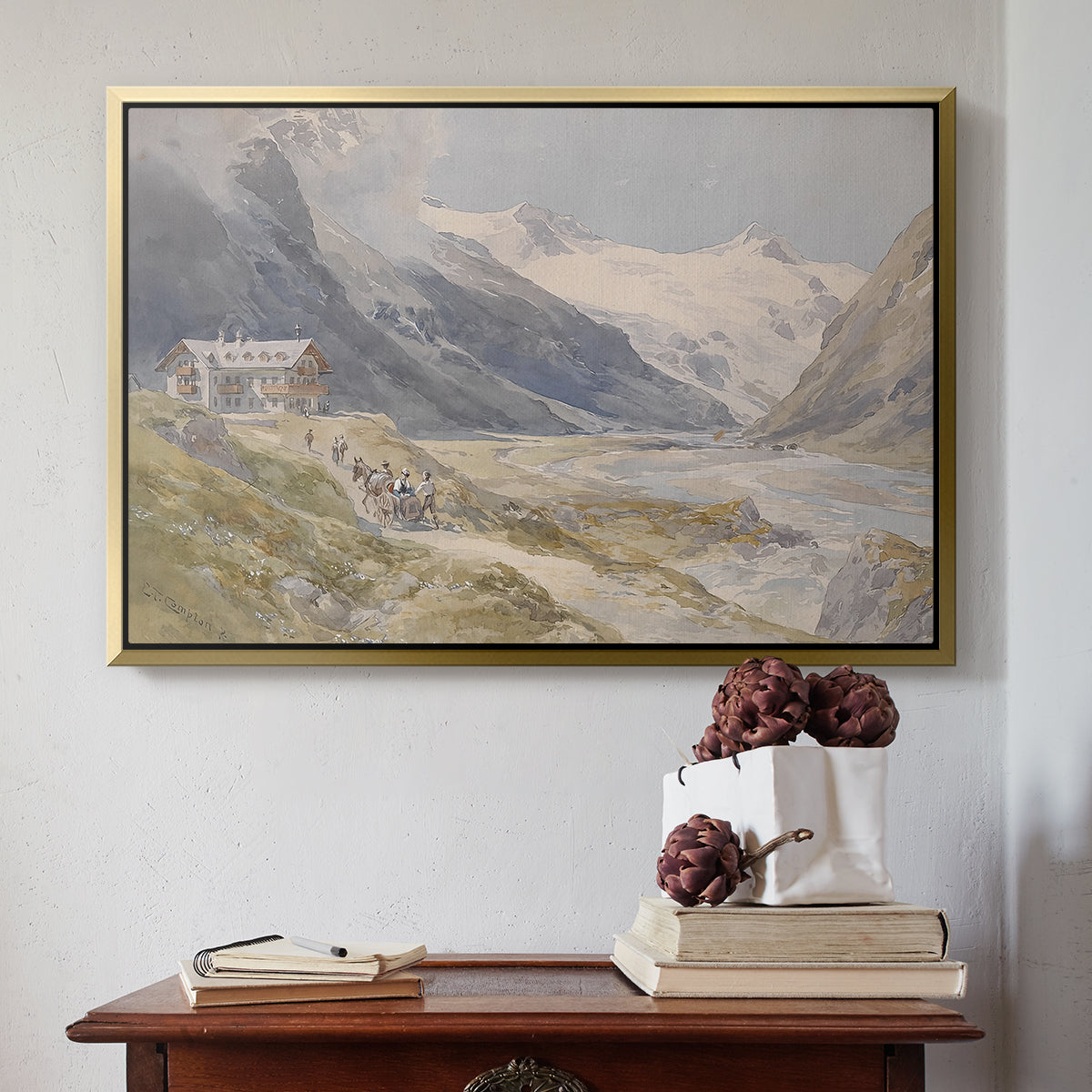 Gold floater framed canvas featuring Shepherds (Pasterze), c. 1921 by Edward Theodore Compton above an entryway table in a minimalist foyer.