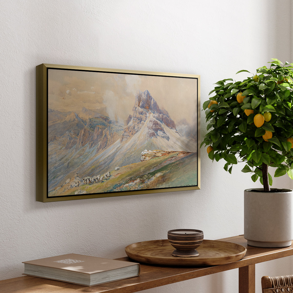 From the Dolomites, 1904 by Edward Theodore Compton, presented in a gold floater framed canvas featuring dramatic Dolomite mountain peaks rising above rugged terrain, displayed above a hallway console table.