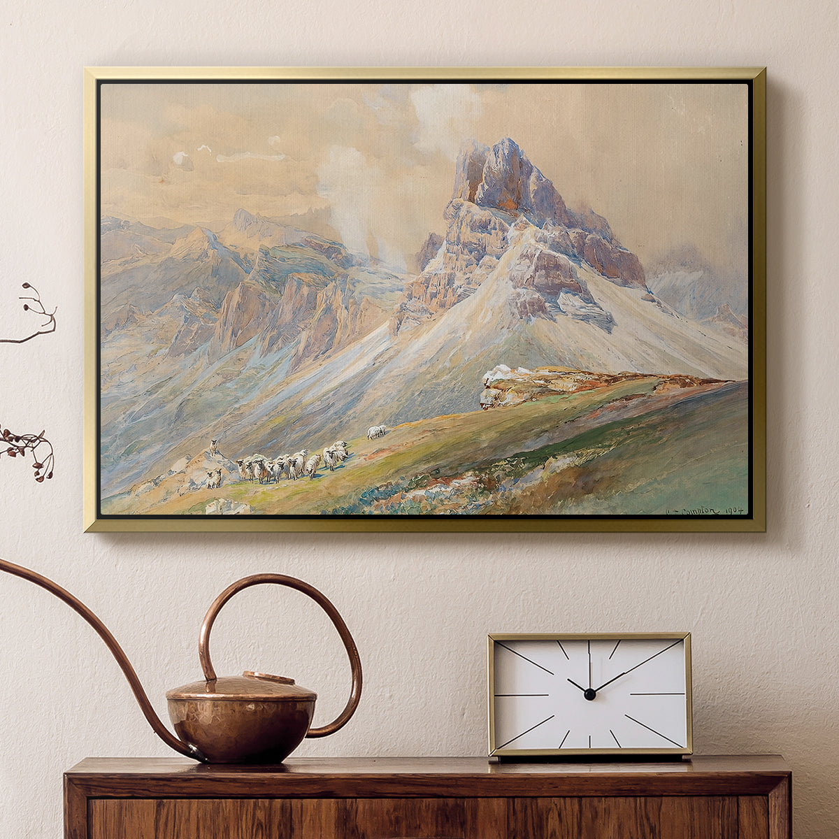 Gold floater framed canvas featuring an expansive landscape featuring iconic Dolomite peaks, displayed above a cabinet in a soft-toned living room.
