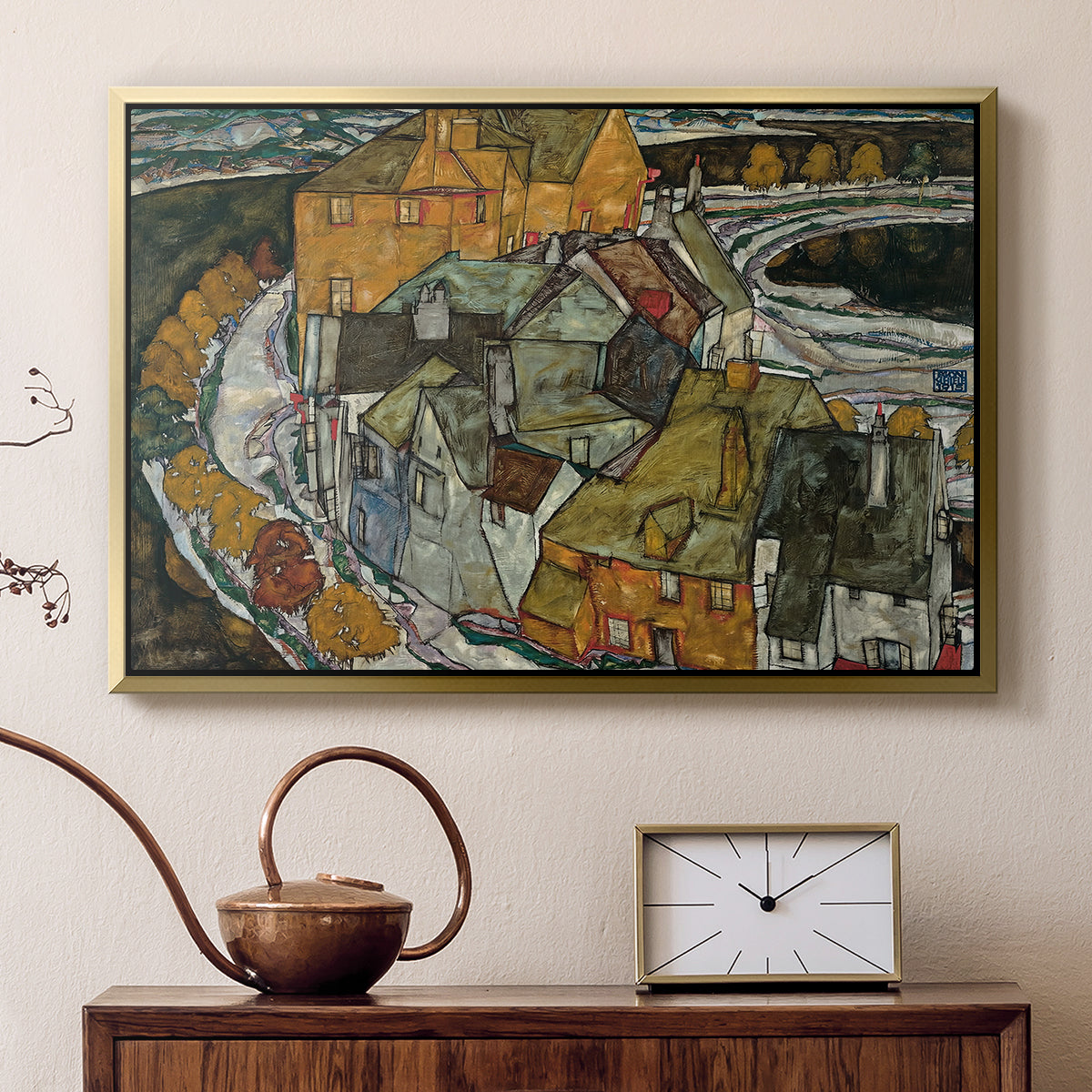 Gold floater framed canvas featuring an expressionist depiction of island town with geometric forms, displayed above a cabinet in a soft-toned living room.
