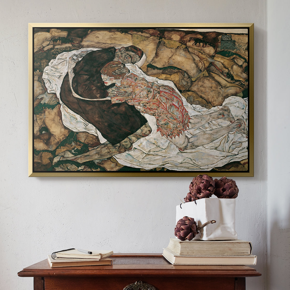 Gold floater framed canvas featuring Death and the Maiden, 1915 by Egon Schiele above an entryway table in a minimalist foyer.