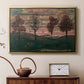Gold floater framed canvas featuring a stylized nature scene with strong outlines and simple composition, displayed above a cabinet in a soft-toned living room.